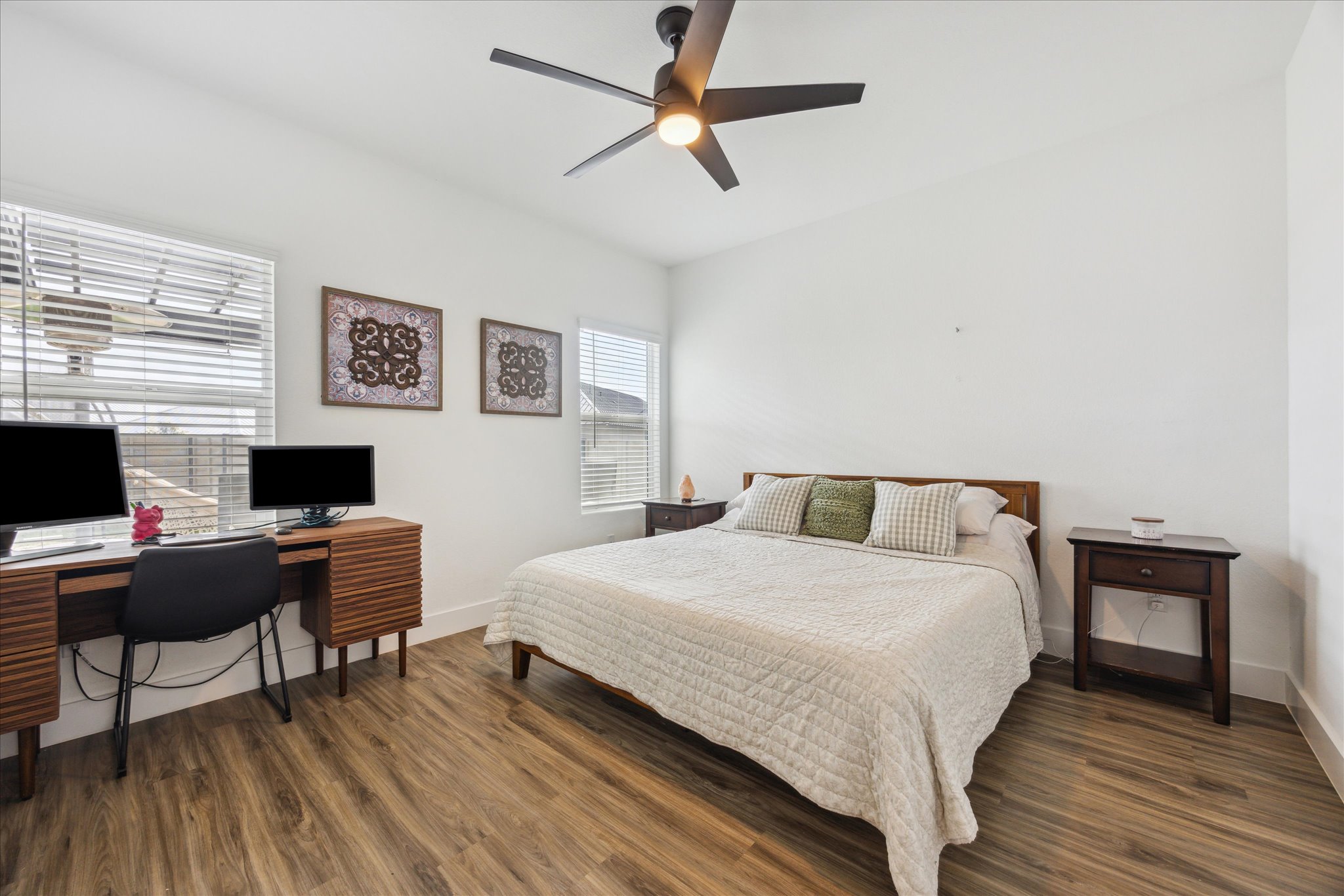 700 Legends Lane Georgetown, TX 78628 - Photo 14 of 31 Bedroom featuring wood finished floors, baseboards, an office area, and a ceiling fan