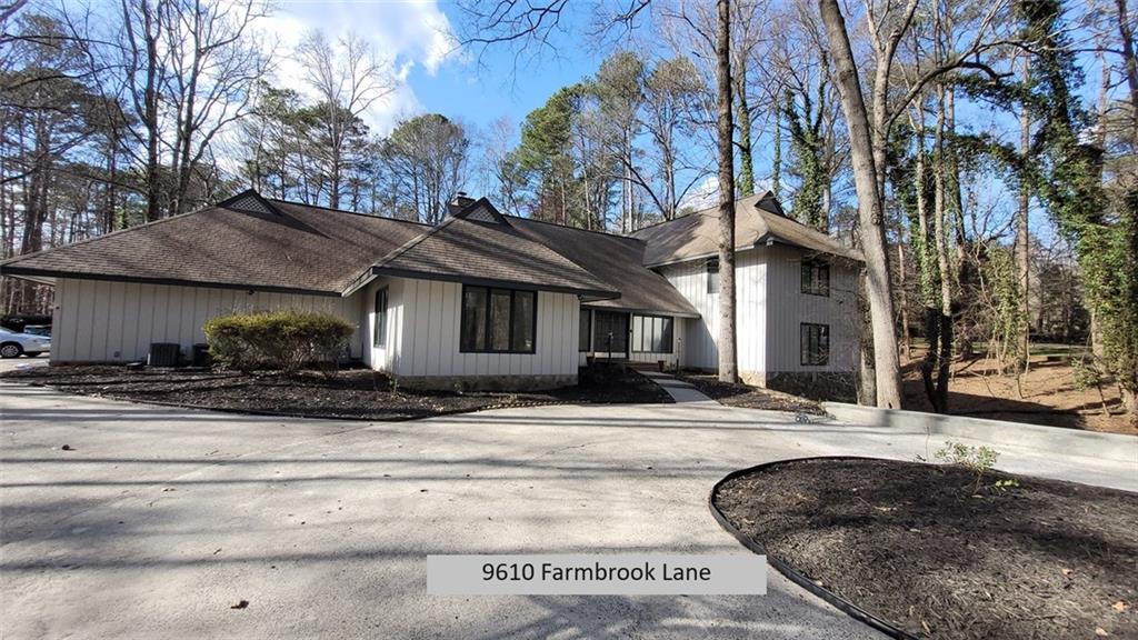 9610 Farmbrook Lane Alpharetta, GA 30022 - Photo 1 of 1 a view of a house with a yard covered with snow