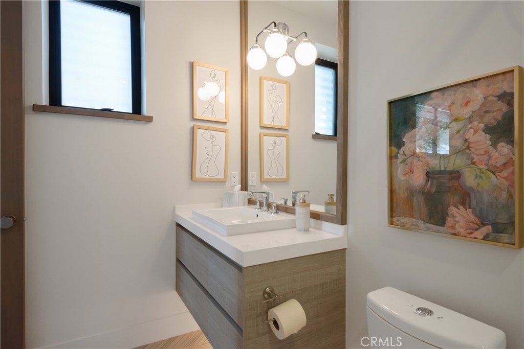 3218 Morningside Drive Hermosa Beach, CA 90254 - Photo 11 of 43 a bathroom with a sink vanity and a mirror