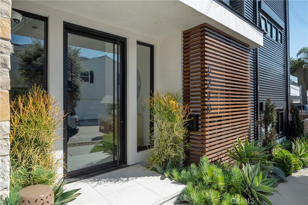3218 Morningside Drive Hermosa Beach, CA 90254 - Photo 2 of 43 a potted plant sitting in front of a house