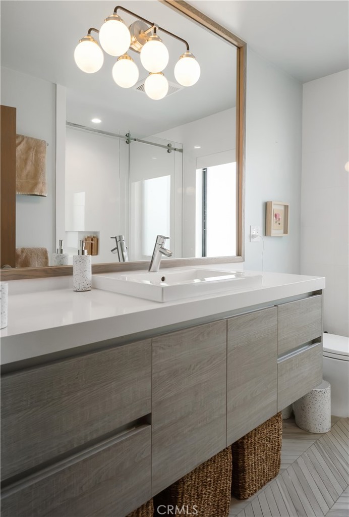 3218 Morningside Drive Hermosa Beach, CA 90254 - Photo 23 of 43 a bathroom with a double vanity sink and a mirror