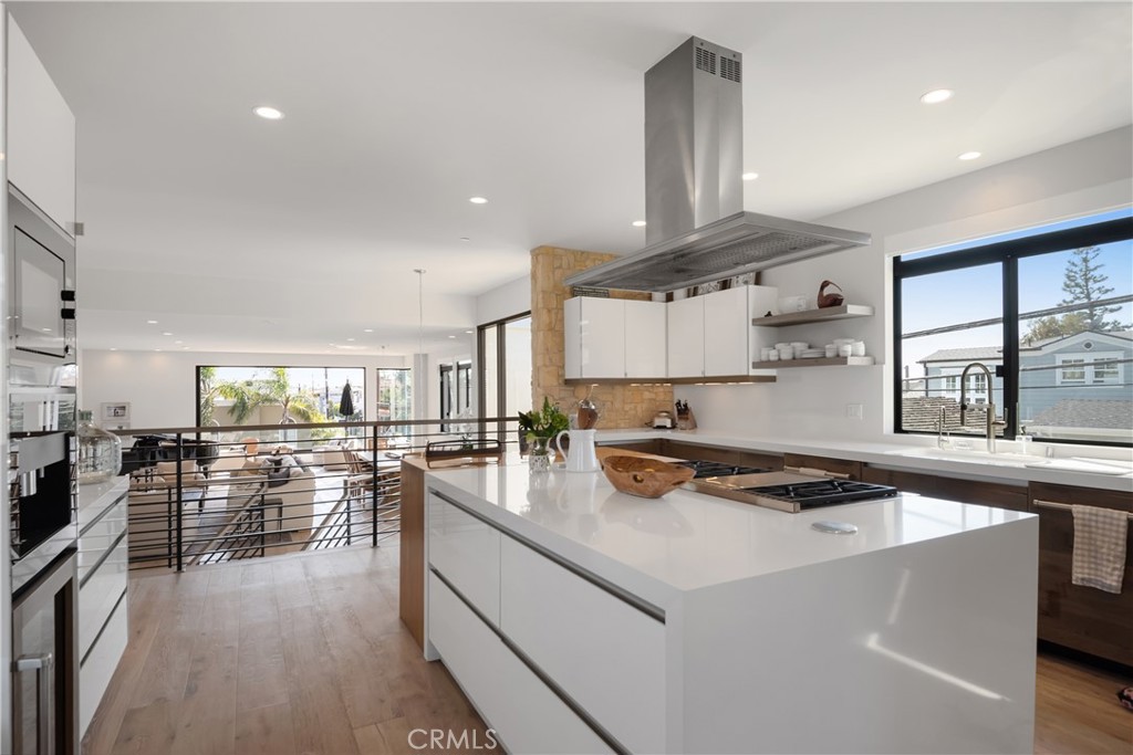 3218 Morningside Drive Hermosa Beach, CA 90254 - Photo 32 of 43 a kitchen with a stove cabinets and window