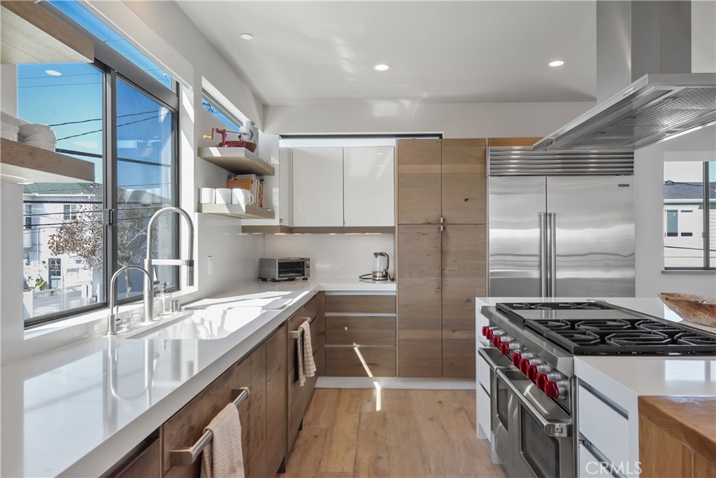 3218 Morningside Drive Hermosa Beach, CA 90254 - Photo 35 of 43 a kitchen that has a sink a stove and a refrigerator