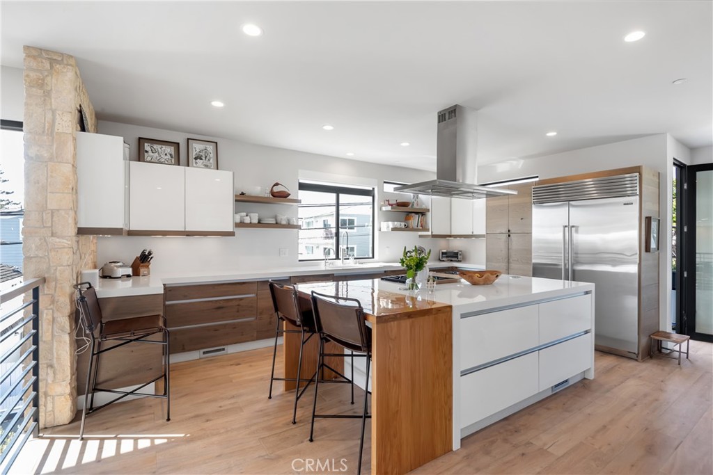 3218 Morningside Drive Hermosa Beach, CA 90254 - Photo 36 of 43 a kitchen with stainless steel appliances kitchen island granite countertop a sink and cabinets