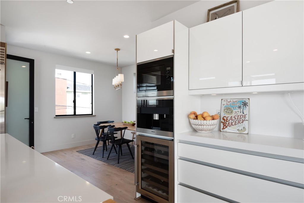 3218 Morningside Drive Hermosa Beach, CA 90254 - Photo 37 of 43 a kitchen with refrigerator and cabinets