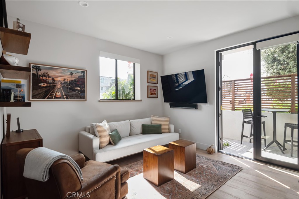3218 Morningside Drive Hermosa Beach, CA 90254 - Photo 7 of 43 a living room with furniture and a flat screen tv