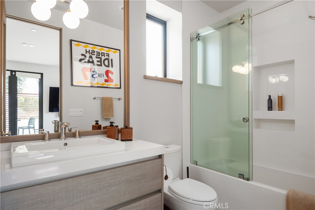 3218 Morningside Drive Hermosa Beach, CA 90254 - Photo 10 of 43 a bathroom with a sink a toilet a shower and a mirror