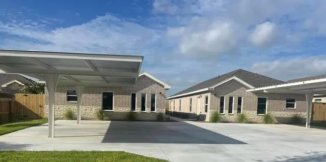 a view of a house with entrance gate