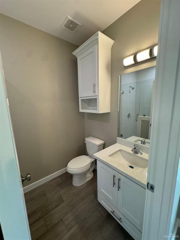 5609 Nightingale Avenue, Unit 2 Mission, TX 78573 - Photo 12 of 13 a bathroom with a sink and a toilet