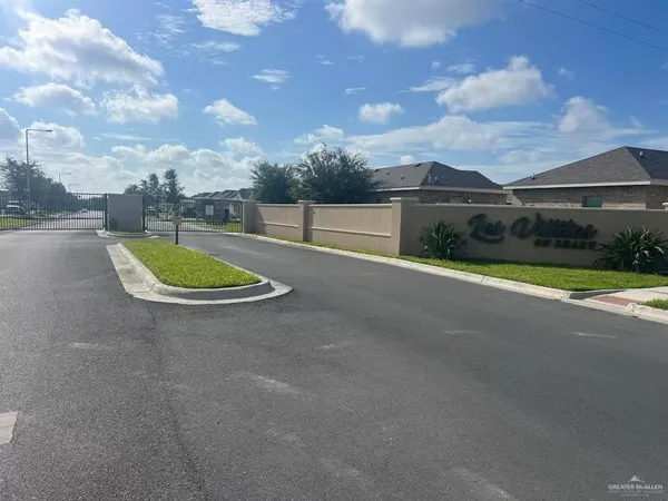 a view of a road with a big yard