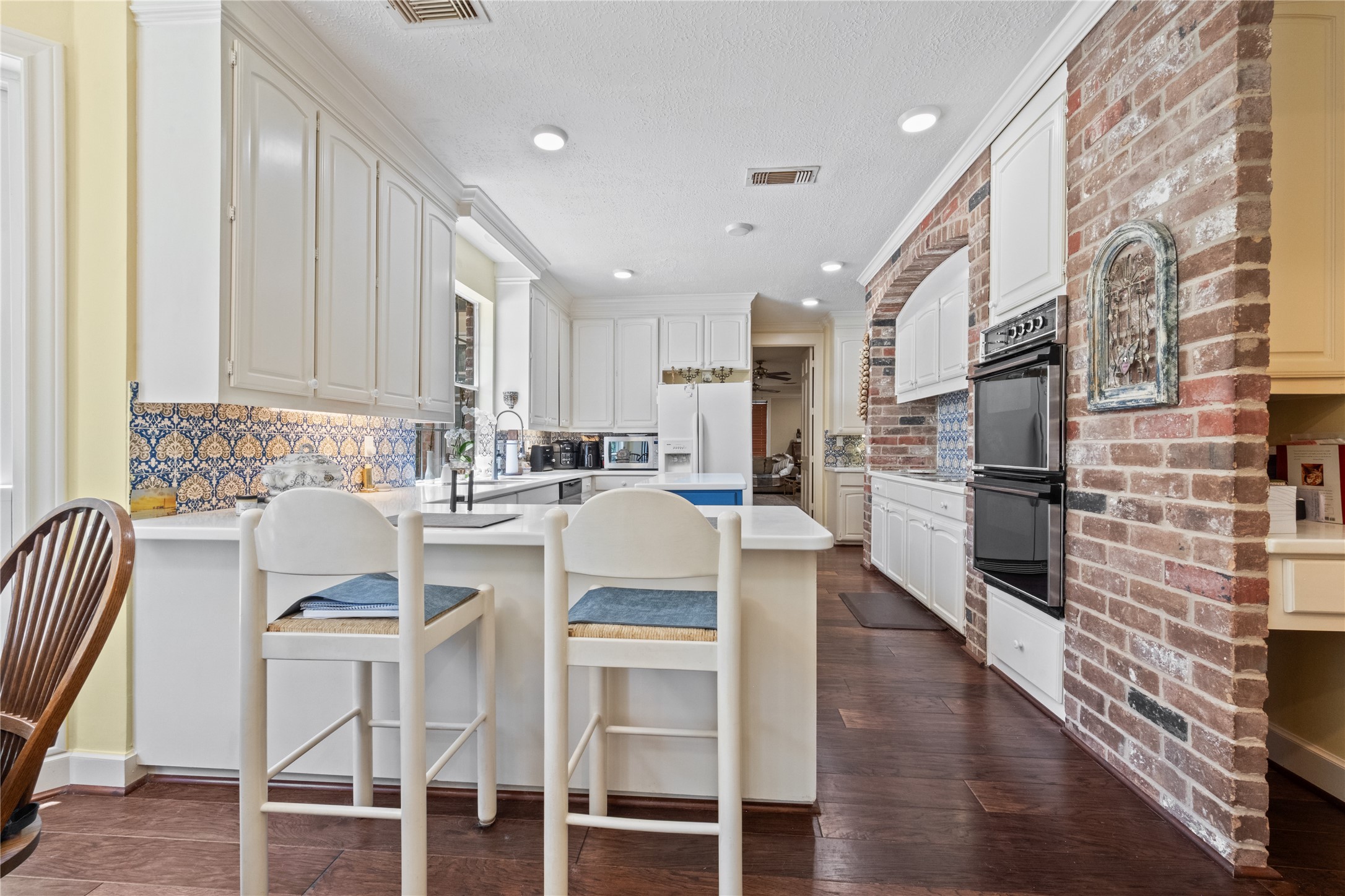 7639 Post Bridge Road Spring, TX 77389 - Photo 11 of 42 a kitchen with granite countertop white cabinets and stainless steel appliances