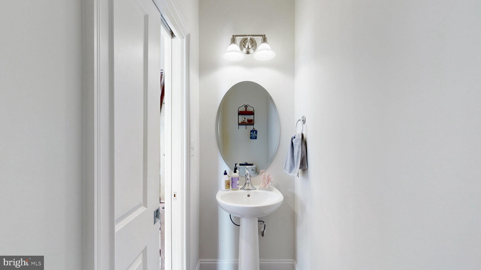 819 Mapleton Avenue Middletown, DE 19709 - Photo 15 of 56 a bathroom with a sink and a mirror