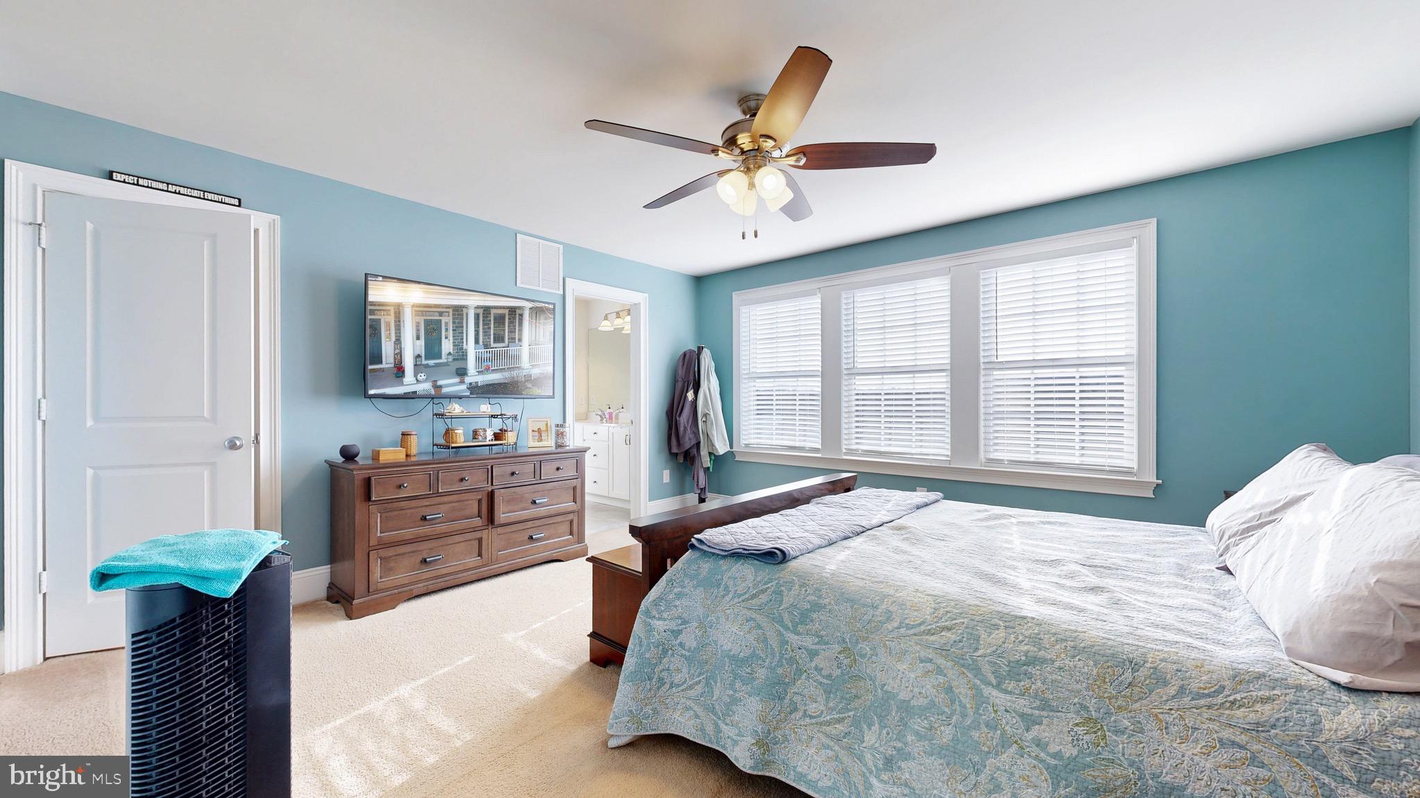 819 Mapleton Avenue Middletown, DE 19709 - Photo 24 of 56 a bedroom with a bed and dresser with mirror