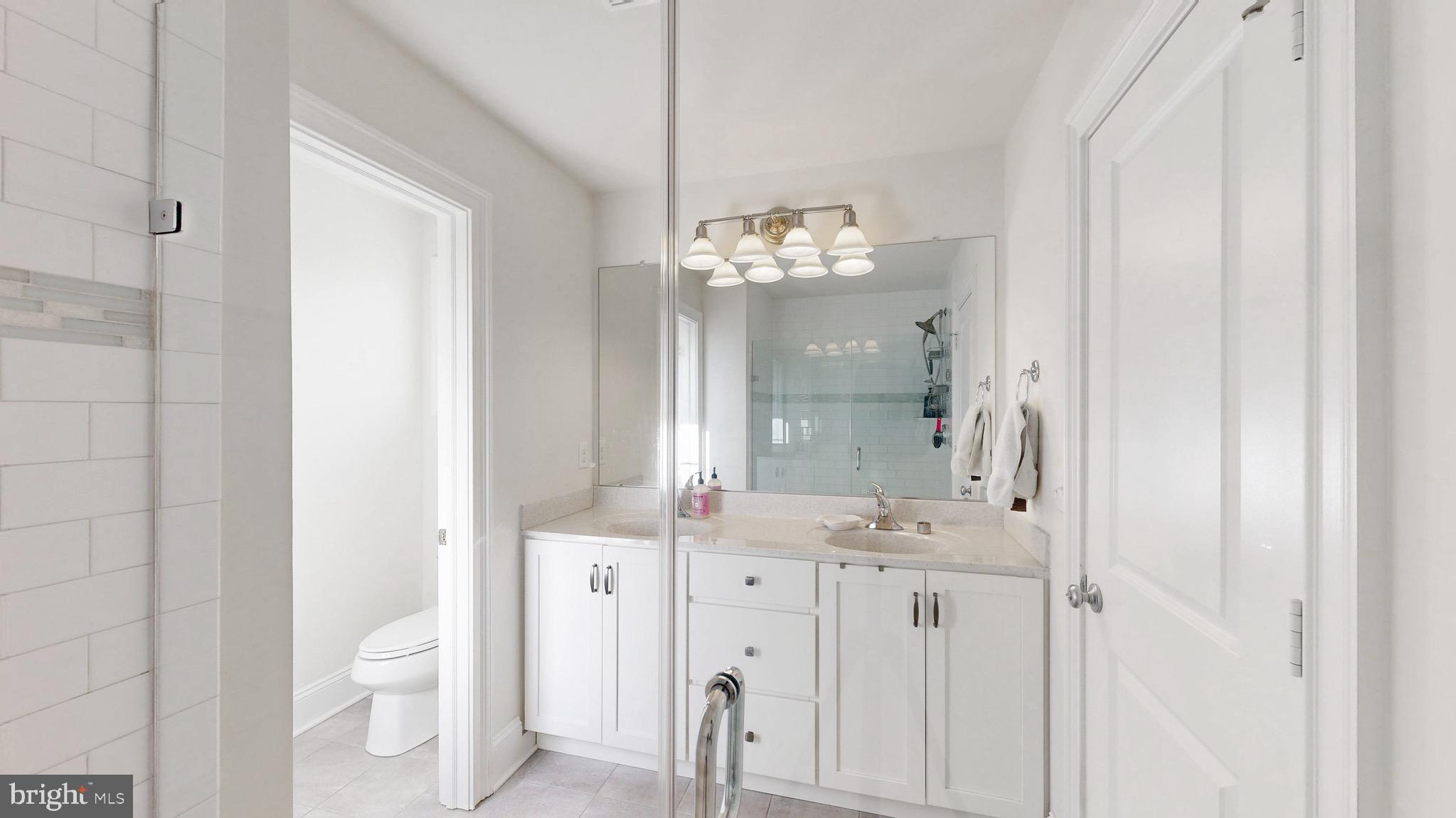 819 Mapleton Avenue Middletown, DE 19709 - Photo 25 of 56 a bathroom with a double vanity sink mirror and toilet