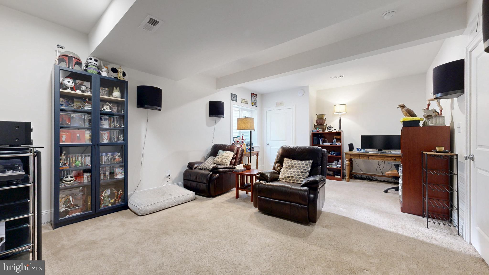 819 Mapleton Avenue Middletown, DE 19709 - Photo 34 of 56 a living room with furniture and a flat screen tv