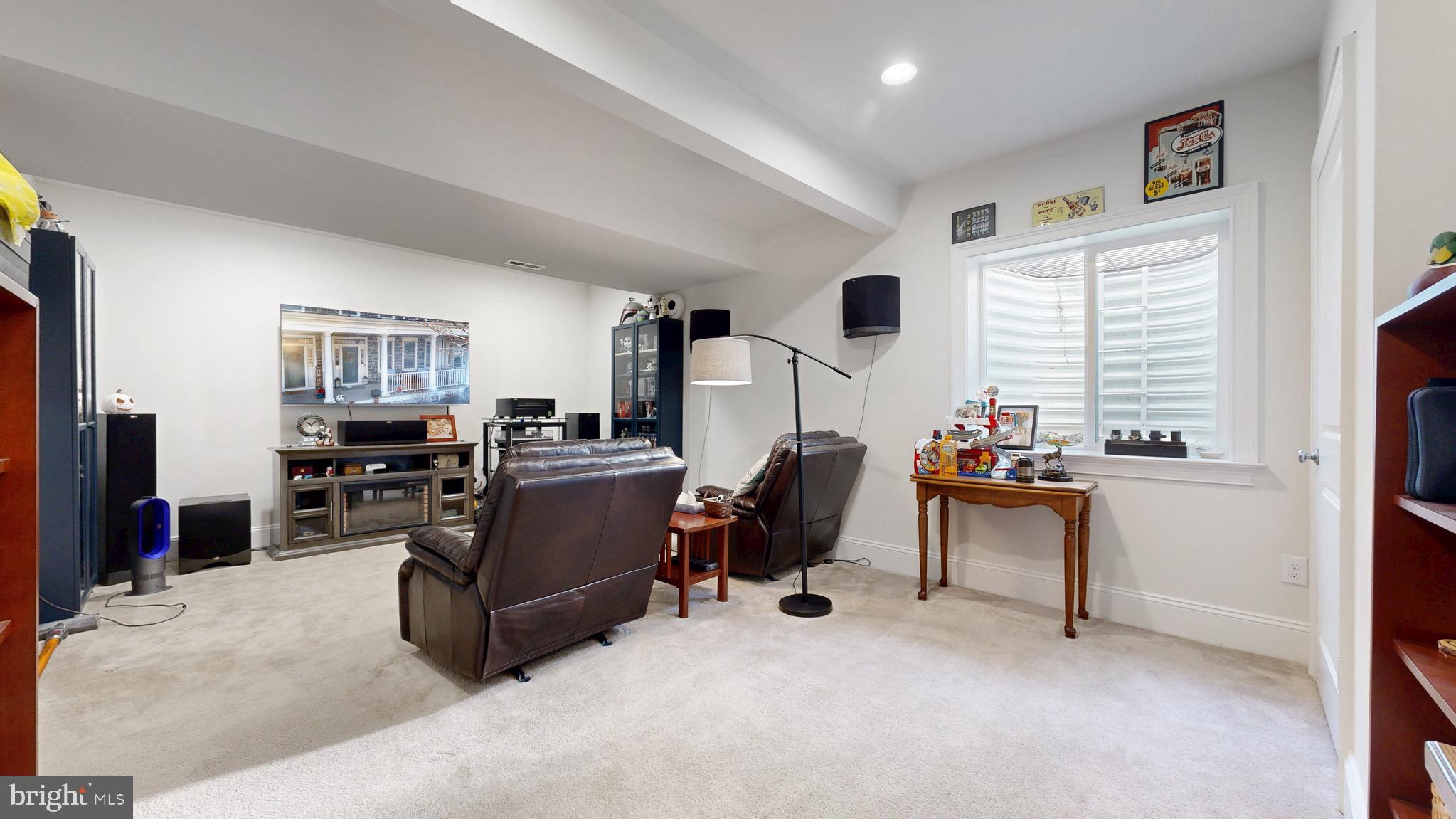 819 Mapleton Avenue Middletown, DE 19709 - Photo 36 of 56 a living room with furniture and a flat screen tv