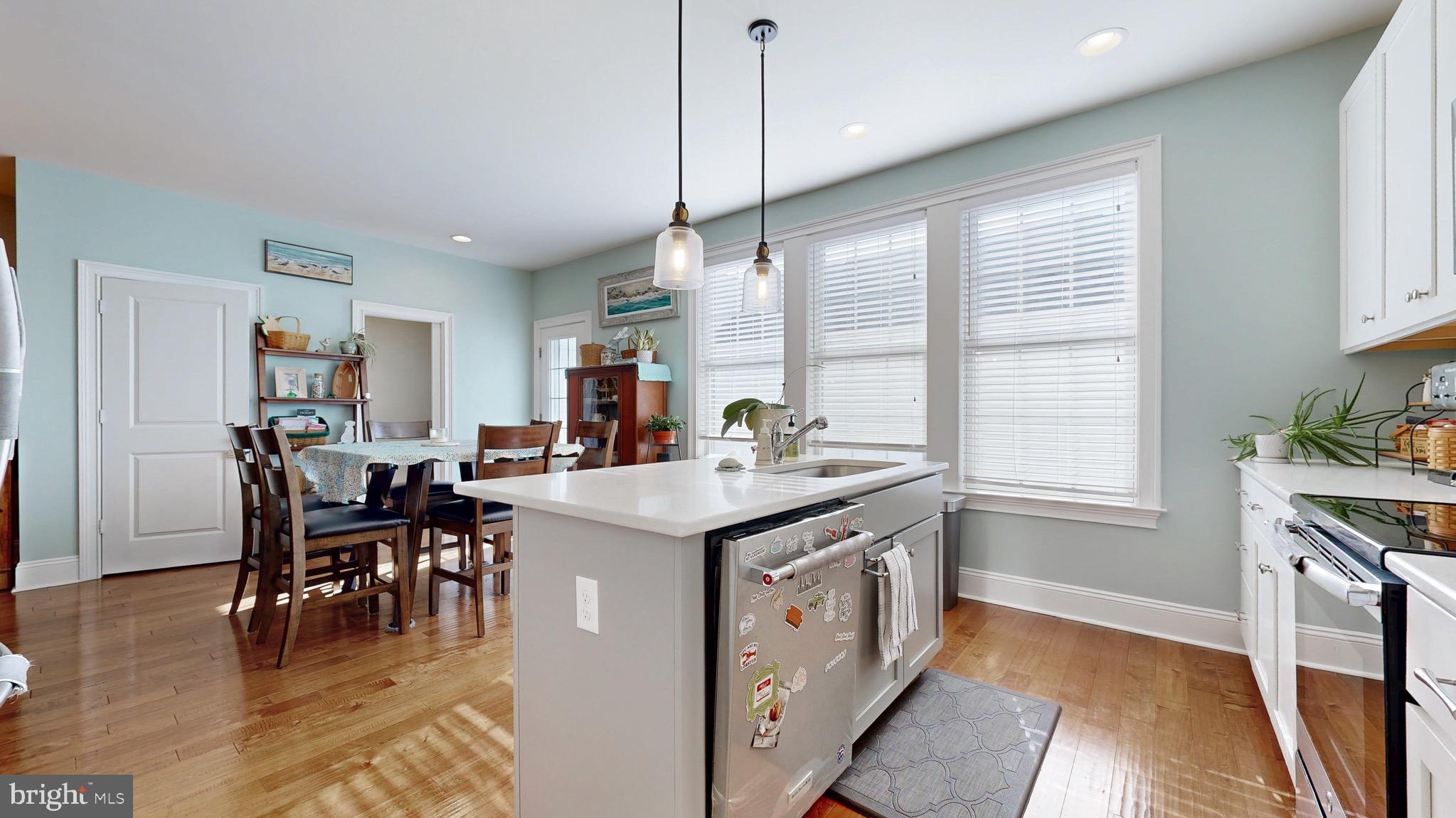 819 Mapleton Avenue Middletown, DE 19709 - Photo 9 of 56 a open kitchen with stainless steel appliances granite countertop a stove and a dining table with cabinets