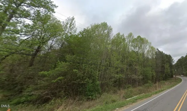 a view of a forest from a balcony