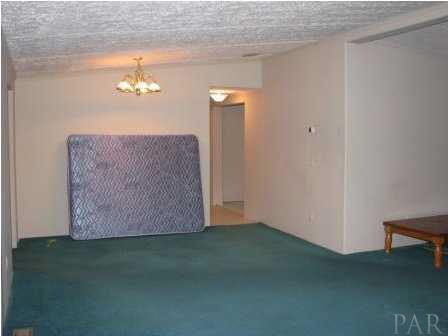 3621 Perdido Lake Road Cantonment, FL 32533 - Photo 14 of 24 View of the living room and dining room from the master bedroom.