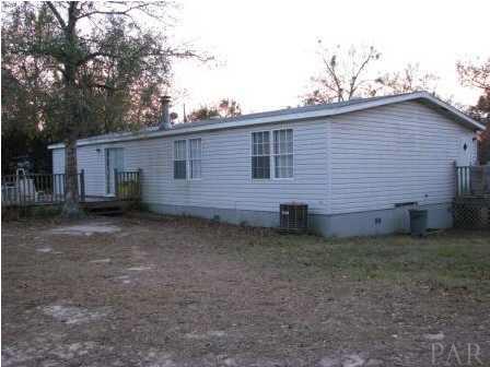 3621 Perdido Lake Road Cantonment, FL 32533 - Photo 2 of 24 Back view of the home and deck