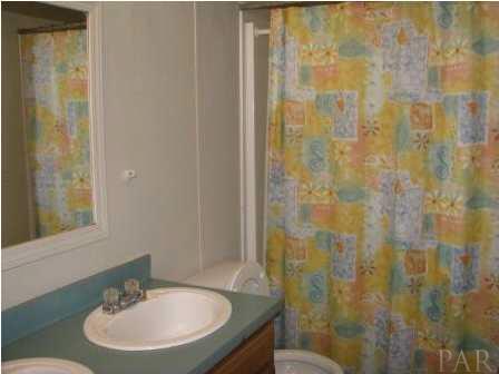 3621 Perdido Lake Road Cantonment, FL 32533 - Photo 22 of 24 Hall bath with shower/tub combination.