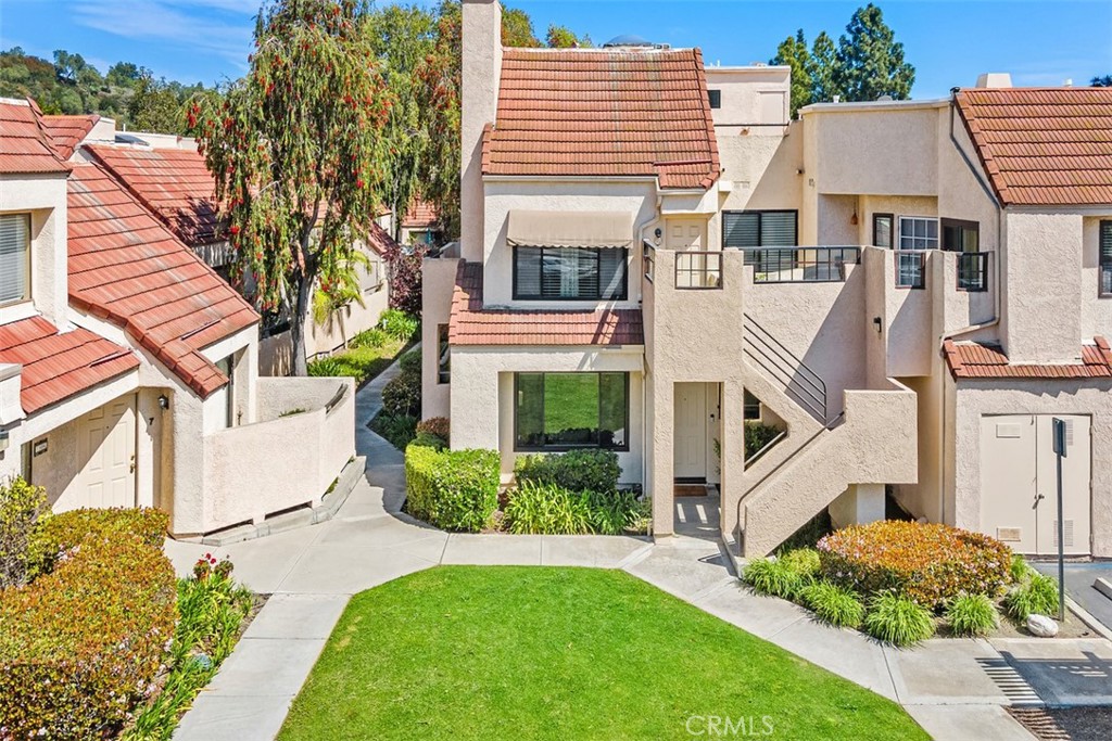 13 Pearl Laguna Niguel, CA 92677 - Photo 1 of 25 a view of a white house next to a yard