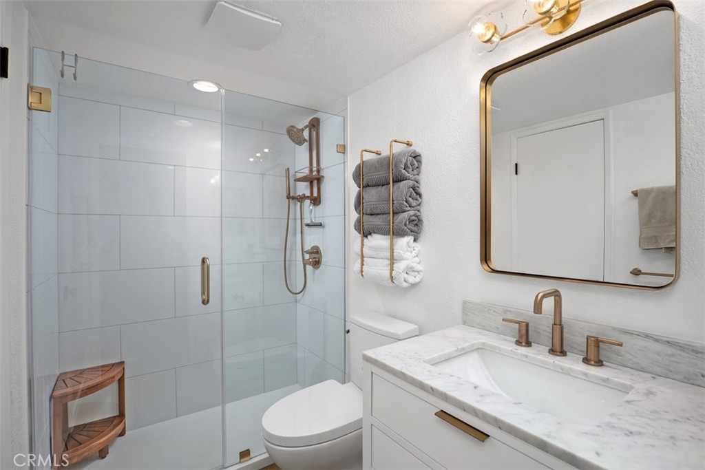 13 Pearl Laguna Niguel, CA 92677 - Photo 14 of 25 a bathroom with a granite countertop sink a toilet and shower