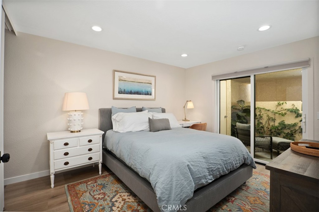 13 Pearl Laguna Niguel, CA 92677 - Photo 15 of 25 a bedroom with a bed and a large window