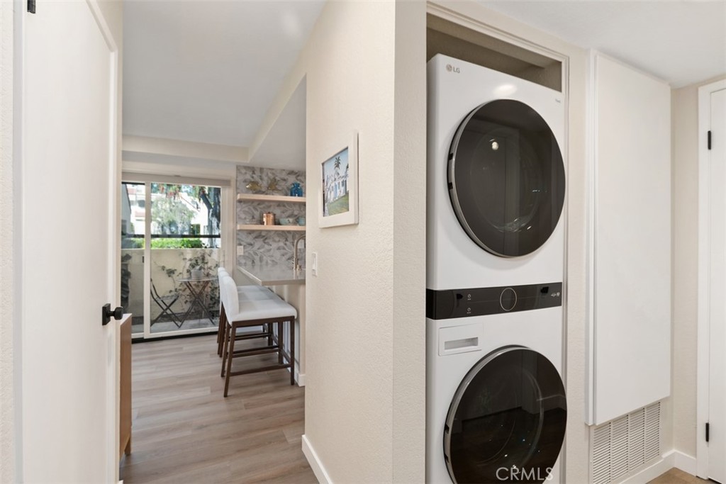 13 Pearl Laguna Niguel, CA 92677 - Photo 18 of 25 a view of a hallway with washer and dryer