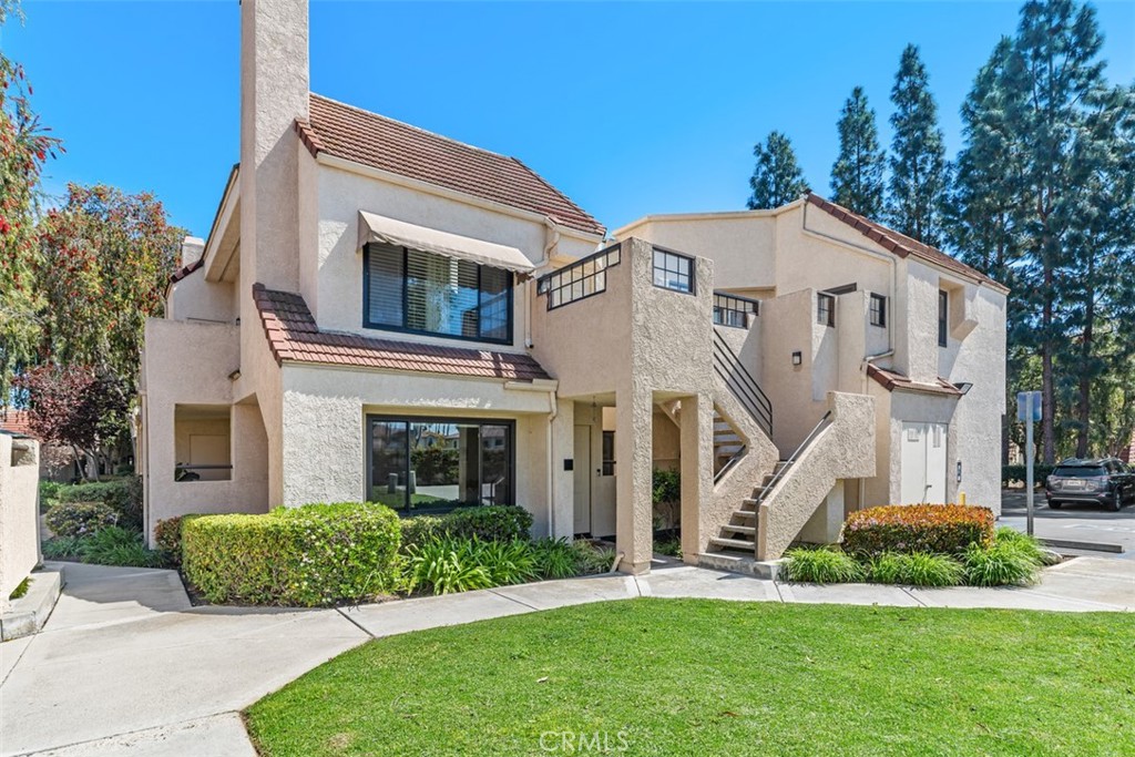 13 Pearl Laguna Niguel, CA 92677 - Photo 22 of 25 a front view of a house with a garden and plants