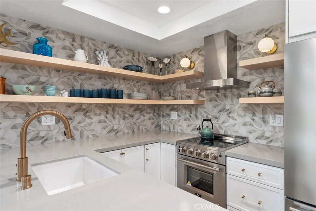 13 Pearl Laguna Niguel, CA 92677 - Photo 3 of 25 a kitchen with a stove and a sink