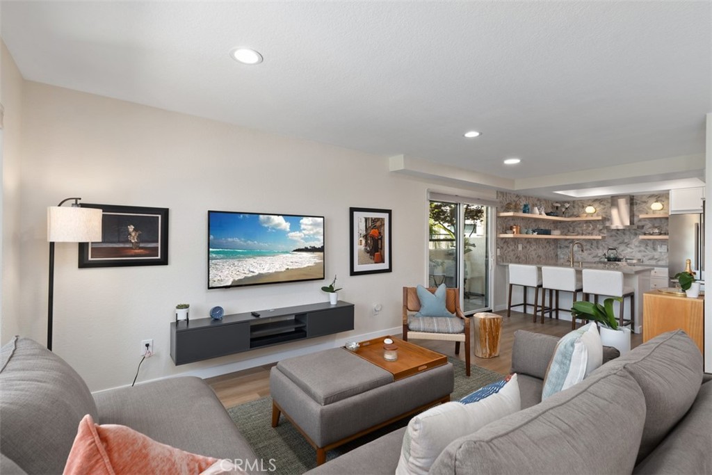 13 Pearl Laguna Niguel, CA 92677 - Photo 5 of 25 a living room with furniture and a flat screen tv