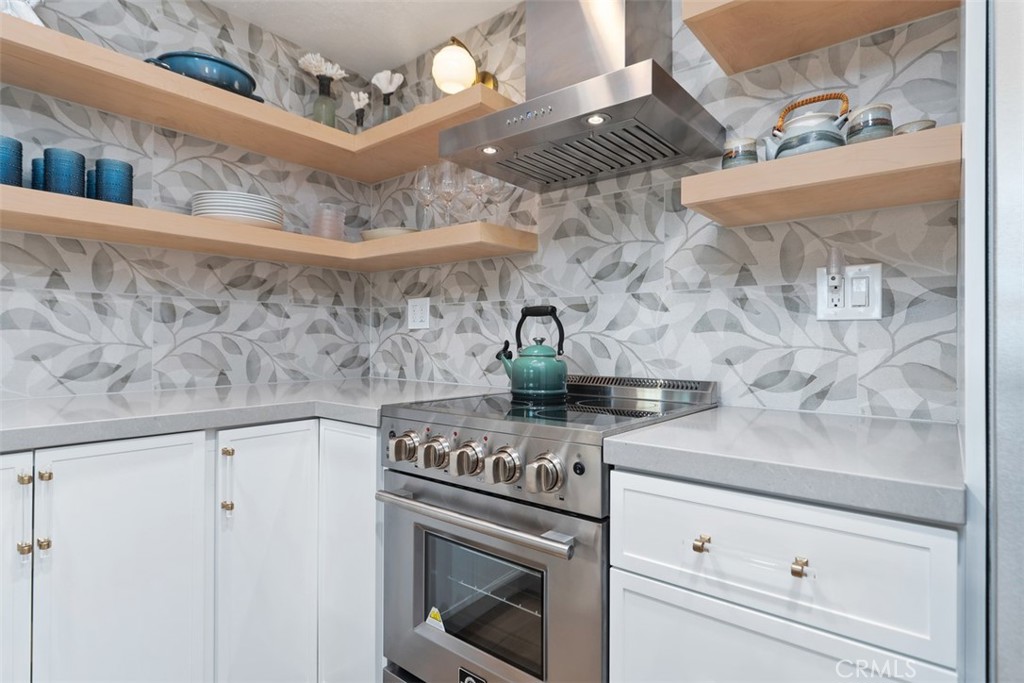 13 Pearl Laguna Niguel, CA 92677 - Photo 8 of 25 a kitchen with a stove and cabinets