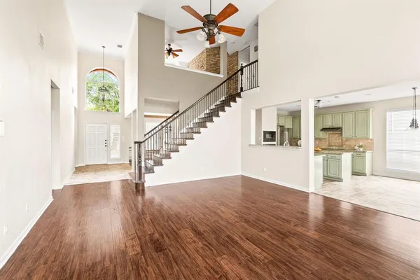 a view of an entryway with wooden floor