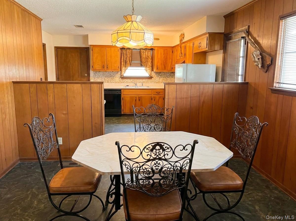 2 Sneden Court Spring Valley, NY 10977 - Photo 3 of 13 a view of a dining room with furniture and a chandelier