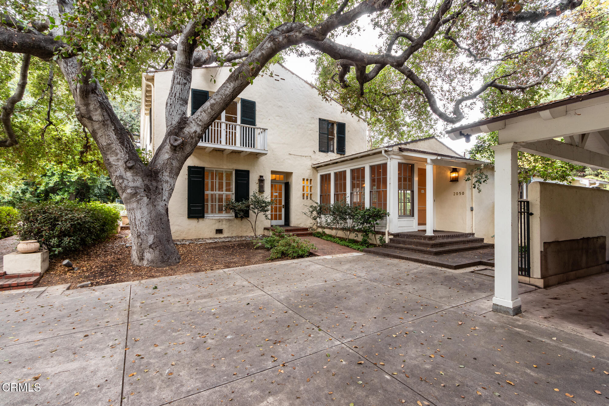 2050 Ashbourne Drive South Pasadena, CA 91030 - Photo 15 of 26 a front view of a house with a yard and garage