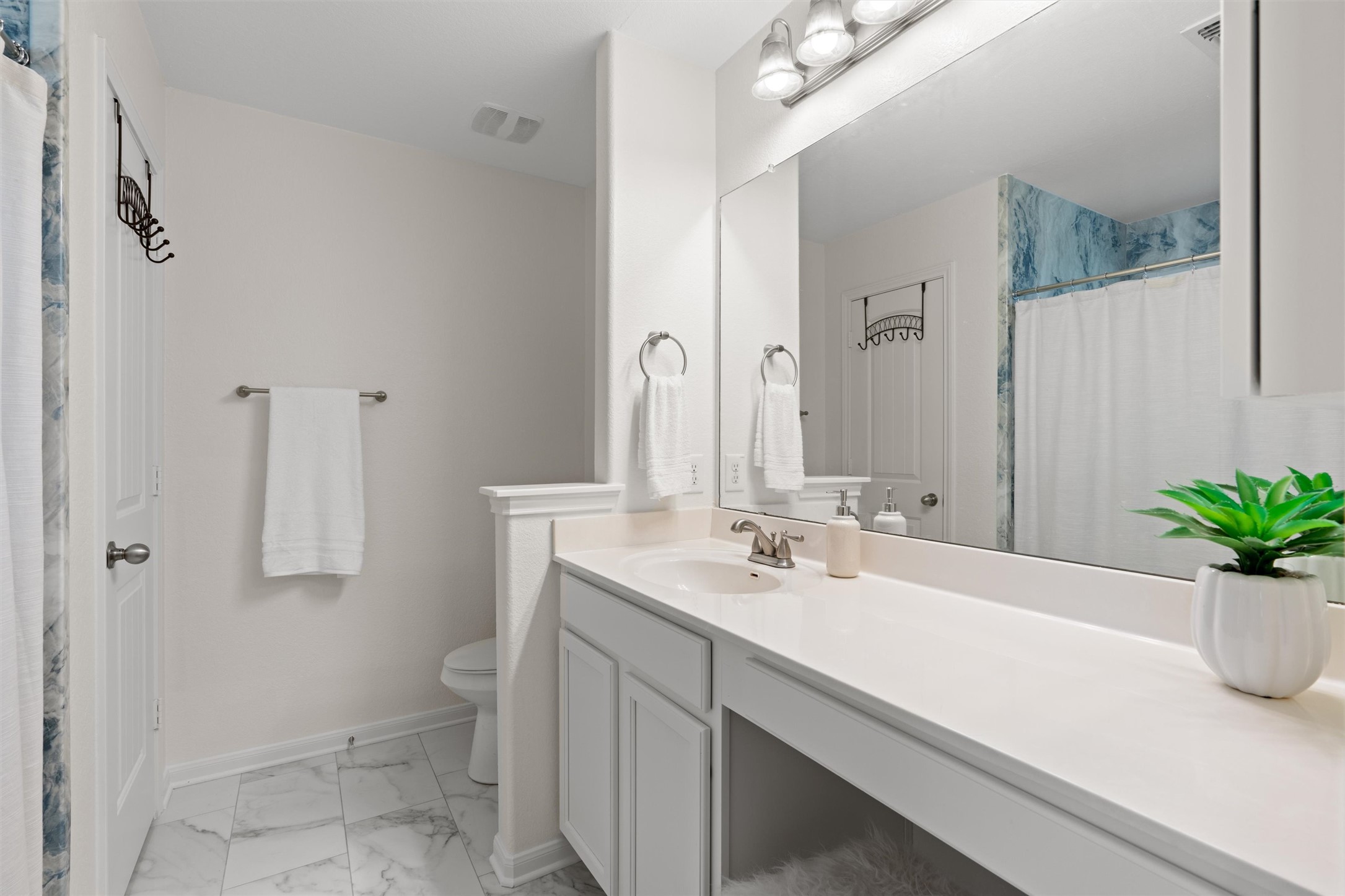 505 Granger Road Georgetown, TX 78626 - Photo 13 of 34 Primary bathroom with a seated dressing counter. Shower is extra large with a recently replaced surround.