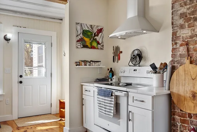 a kitchen with a stove and cabinets