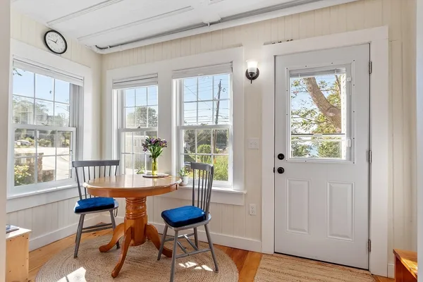 a view of a livingroom with furniture window and wooden floor