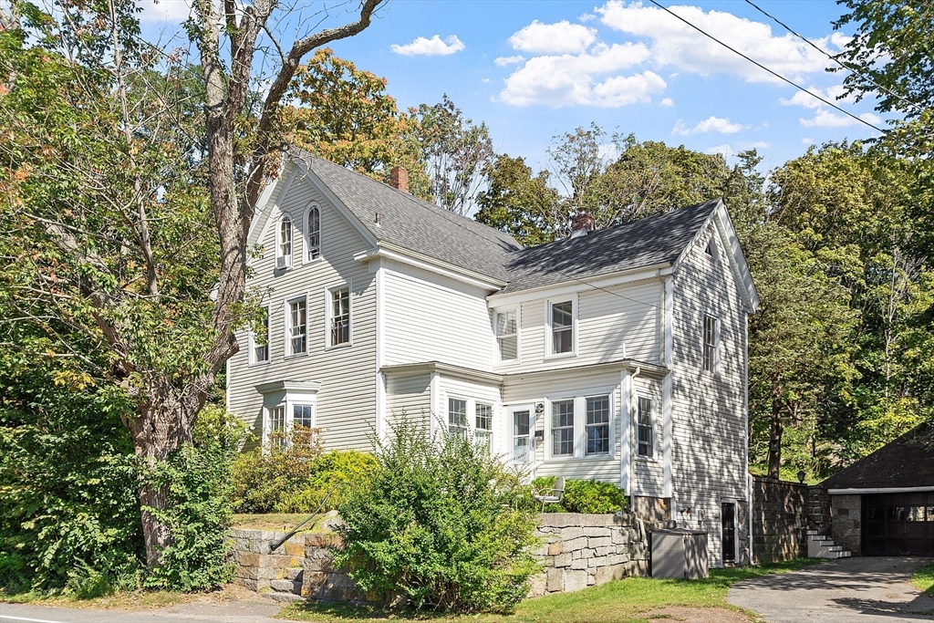 1101 Washington Street, Unit WINTER Gloucester, MA 01930 - Photo 2 of 41 a front view of a house with a garden