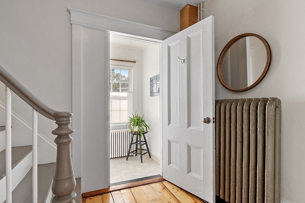 1101 Washington Street, Unit WINTER Gloucester, MA 01930 - Photo 28 of 41 a view of a hallway with entryway wooden floor and front door