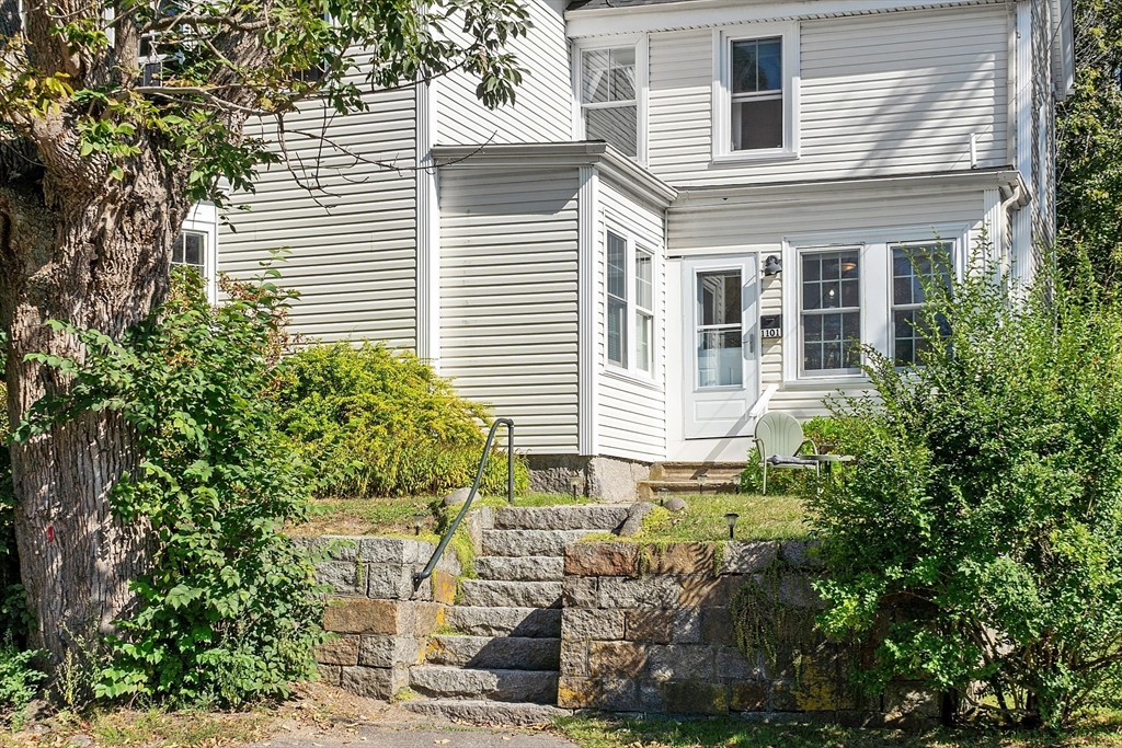 1101 Washington Street, Unit WINTER Gloucester, MA 01930 - Photo 3 of 41 a yellow house with trees in front of it