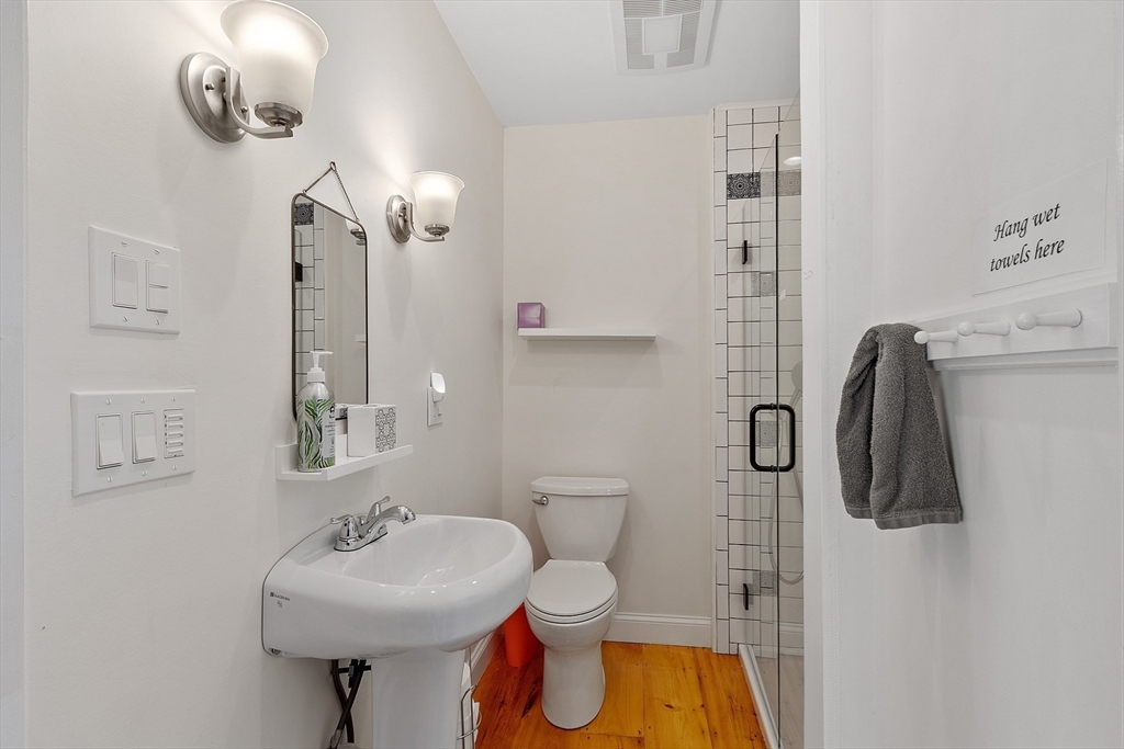 1101 Washington Street, Unit WINTER Gloucester, MA 01930 - Photo 39 of 41 a bathroom with a sink toilet and shower