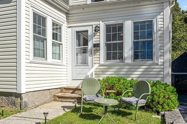 a backyard of a house with outdoor seating