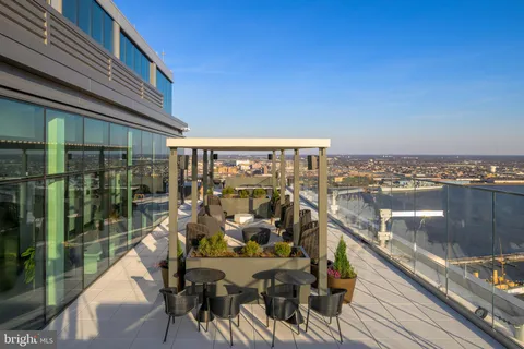 a view of a balcony with two chairs and a table