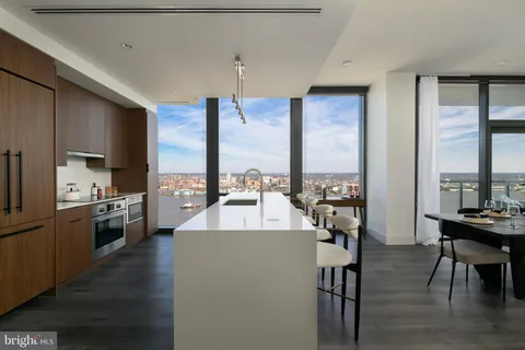 a kitchen with counter top space cabinets and stainless steel appliances