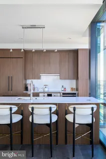 a kitchen with a table and chairs in it