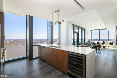 a large kitchen with a large window and counter space