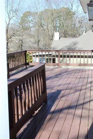 a balcony with wooden floor