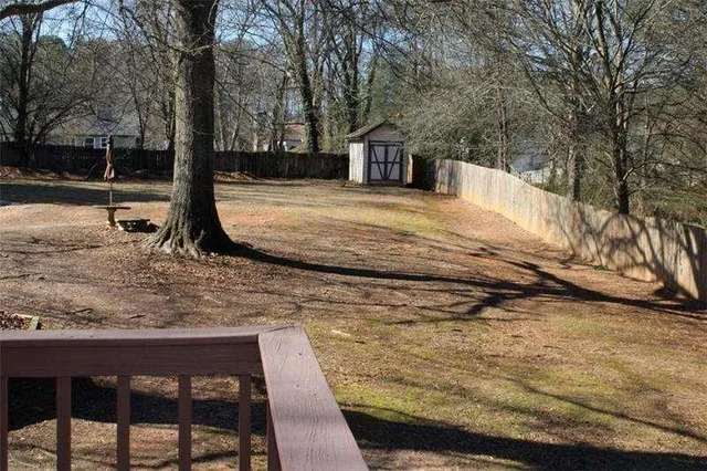 a view of a yard with trees